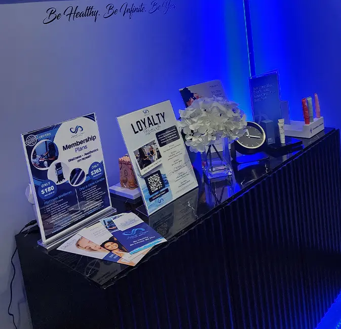 Countertop display showcasing loyalty rewards and Infinite Dripz special membership plans.