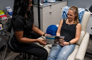 Client receiving consultation and treatment care at Infinite Dripz, offering aesthetic services and IV therapy Highland Park.