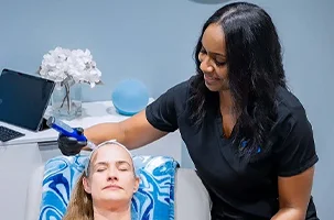 Client receiving a SkinPen microneedling treatment at a med spa and IV therapy clinic near Uptown Dallas.