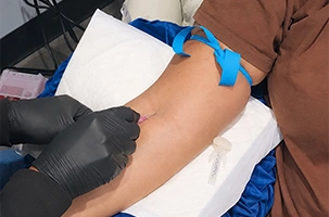 Nurse administering a vitamin injection Lake Highland clients choose for energy and immune support